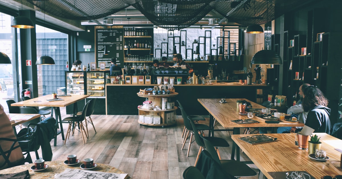 Barista working at a coffee shop, representing Barista FIRE lifestyle