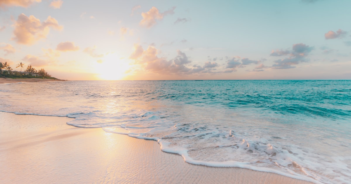 Beautiful beach and ocean representing Coast FIRE and financial freedom