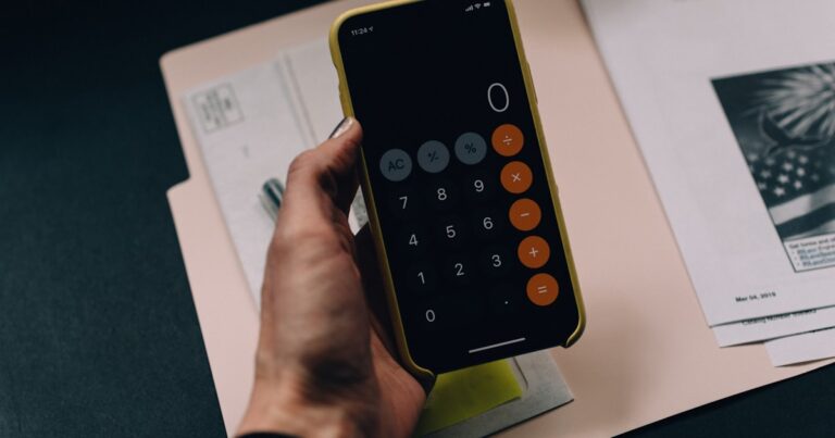 Calculator and financial planning tools representing your freedom number
